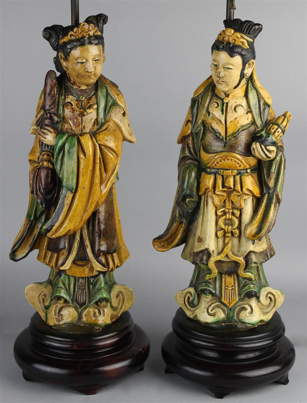 Appraisal: PAIR OF SANCAI-GLAZED POTTERY FIGURES MING DYNASTY each figure modeled