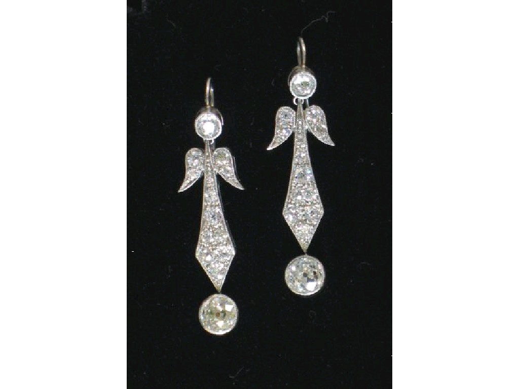 Appraisal: A PAIR OF DIAMOND DROP EARRINGS of stylised leaf-shape millegrain-set