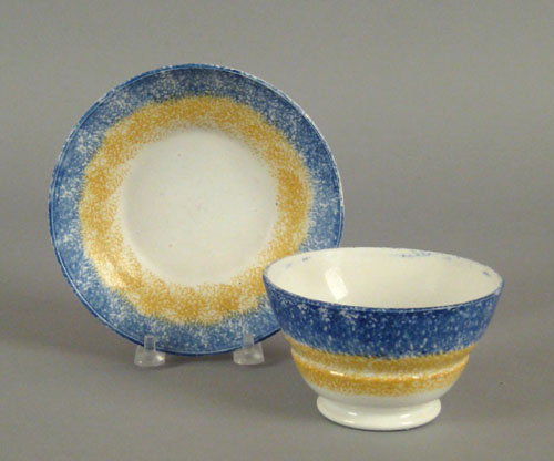 Appraisal: Blue and yellow rainbow spatter cup and saucer th c