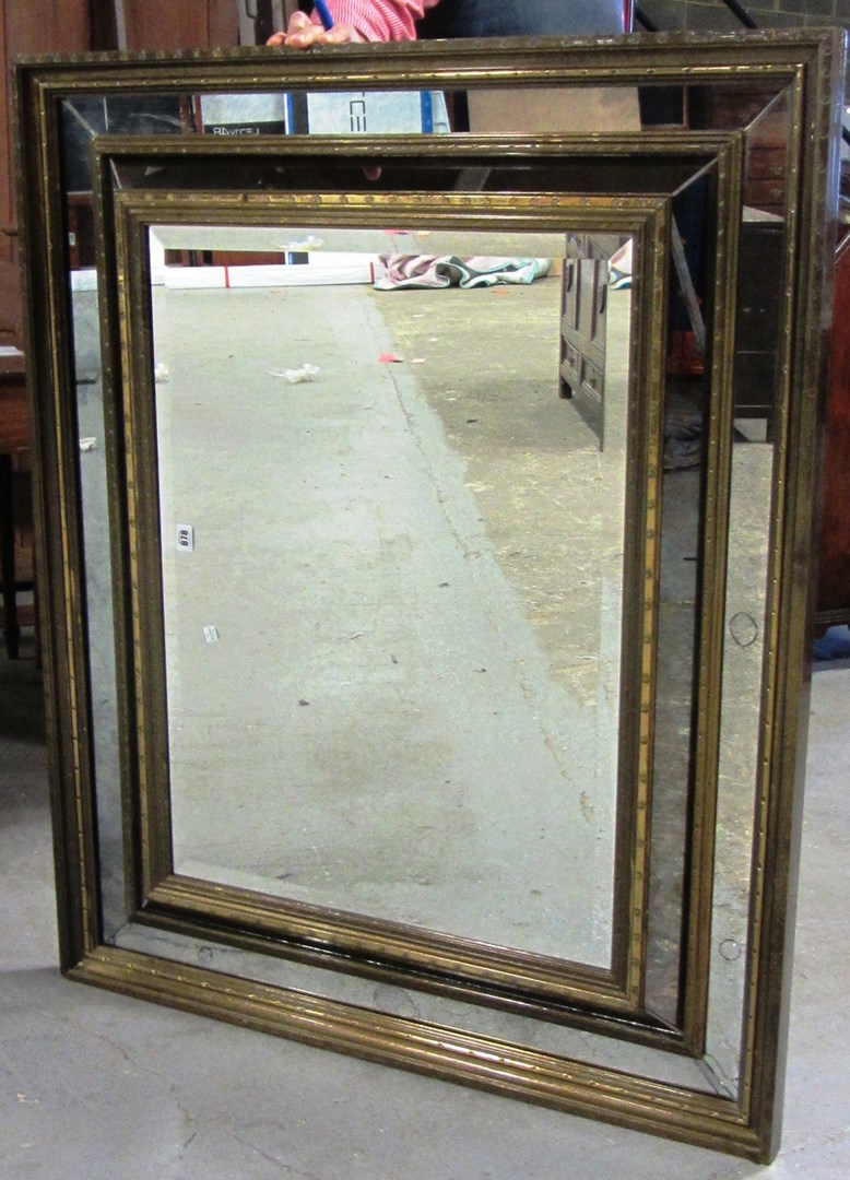 Appraisal: A th century gilt framed bevelled glass sectional wall mirror