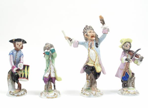 Appraisal: A group of seven Dresden porcelain monkey musicians Comprising conductor