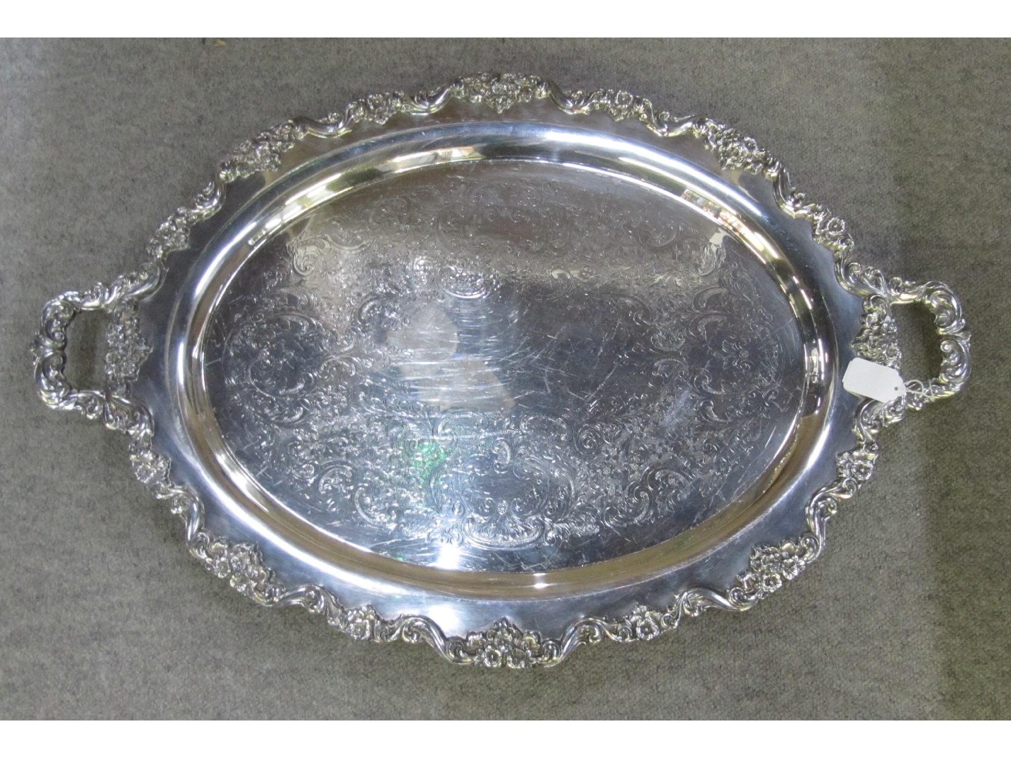 Appraisal: A silver plated double handled serving tray