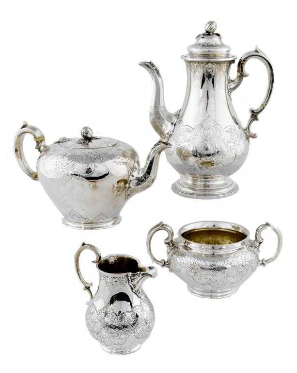 Appraisal: A VICTORIAN TEA AND COFFEE SERVICE of baluster form with