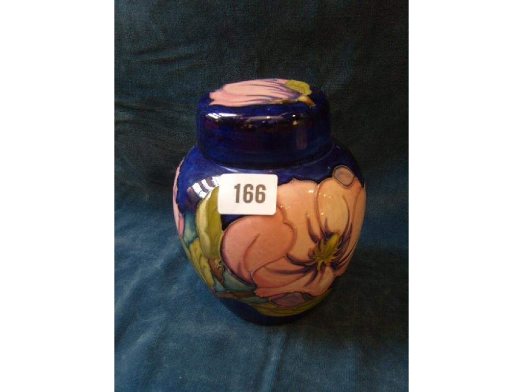 Appraisal: A blue ground Moorcroft ginger jar and cover with magnolia