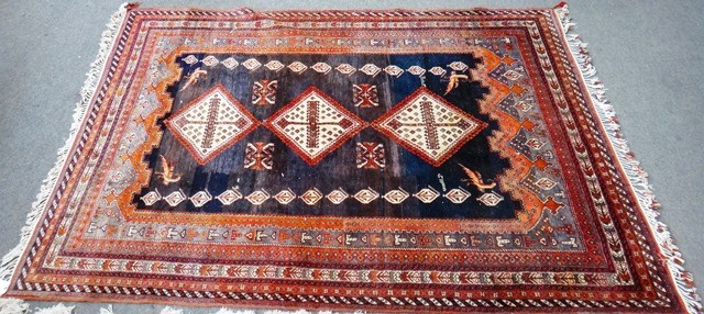 Appraisal: A Ghasghai carpet South Persian the indigo field with three