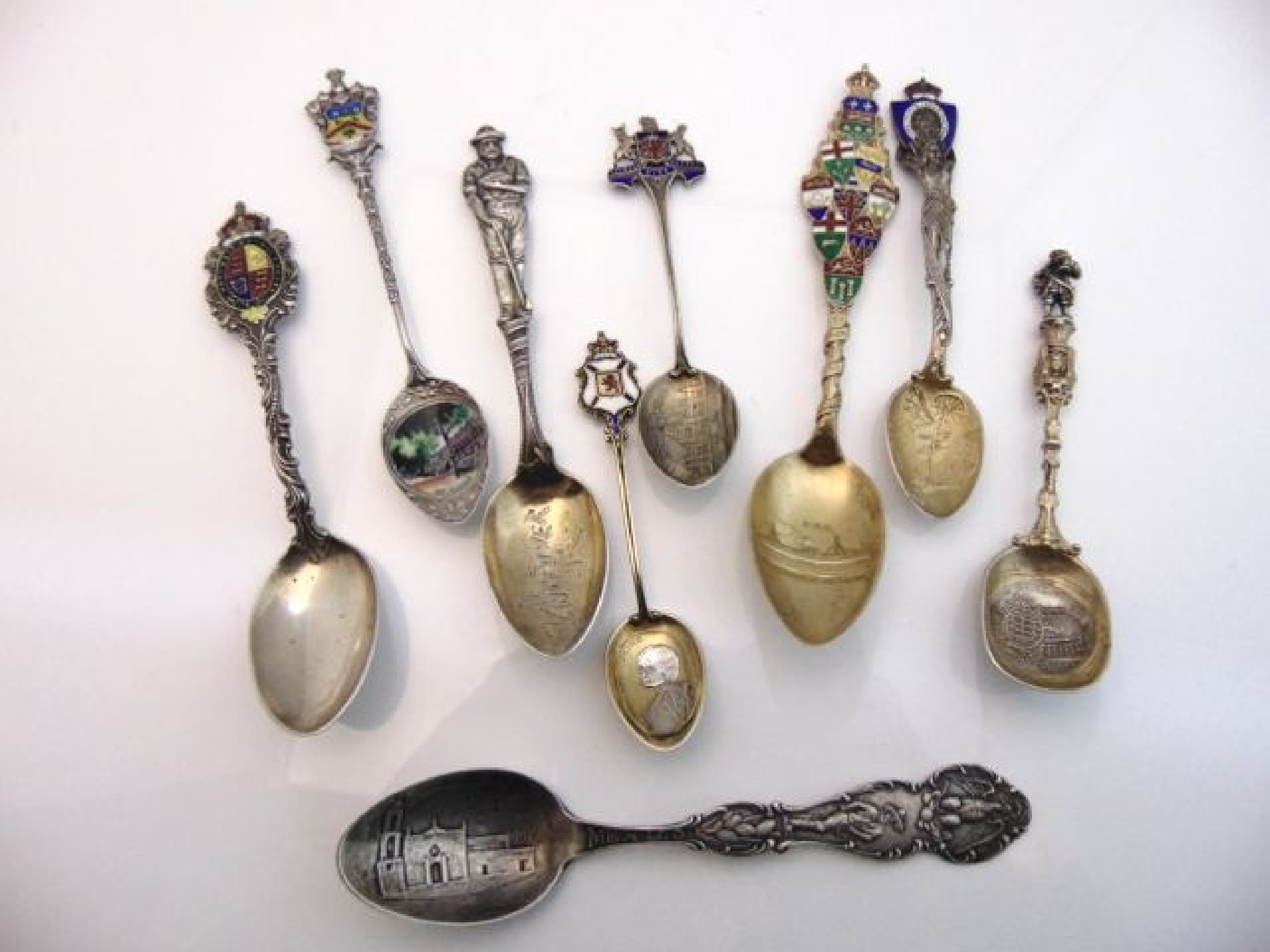 Appraisal: A miscellaneous collection of eight sterling silver souvenir spoons some