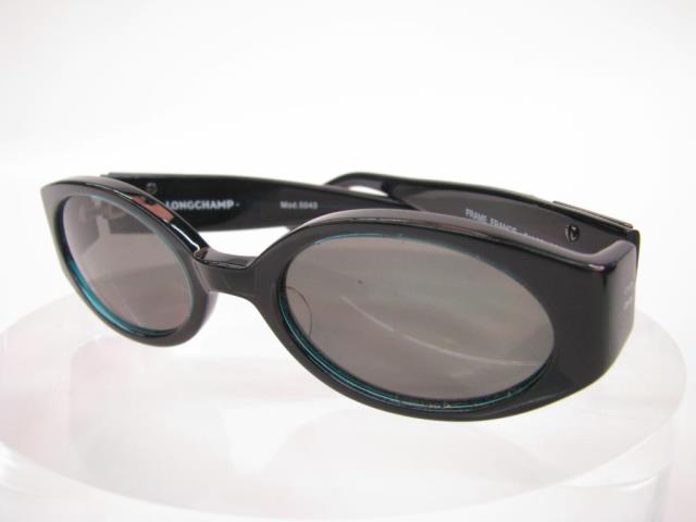 Appraisal: Longchamp Black Frame Sunglasses with green tinted oval lenses Mod