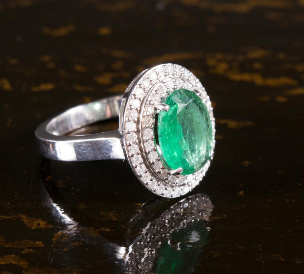 Appraisal: EMERALD DIAMOND AND EIGHTEEN KARAT GOLD RING The k white