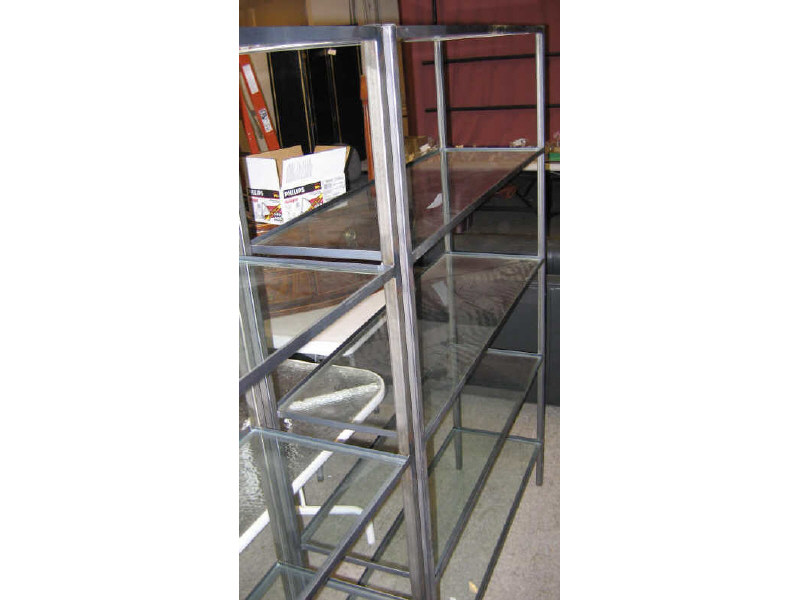 Appraisal: PAIR OF STEEL AND GLASS BOOKSHELVES the tubular frame supporting