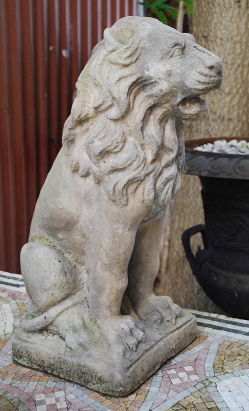 Appraisal: A PAIR OF RECONSTITUTED STONE LION FIGURES each modelled in