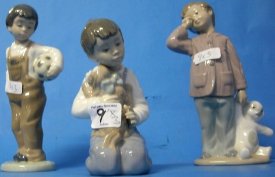 Appraisal: Nao Porcelain figures of Boy with football Boy with Puppy