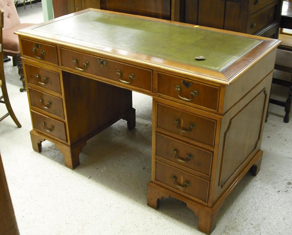 Appraisal: Reproduction yew pedestal desk the green leather inset top over