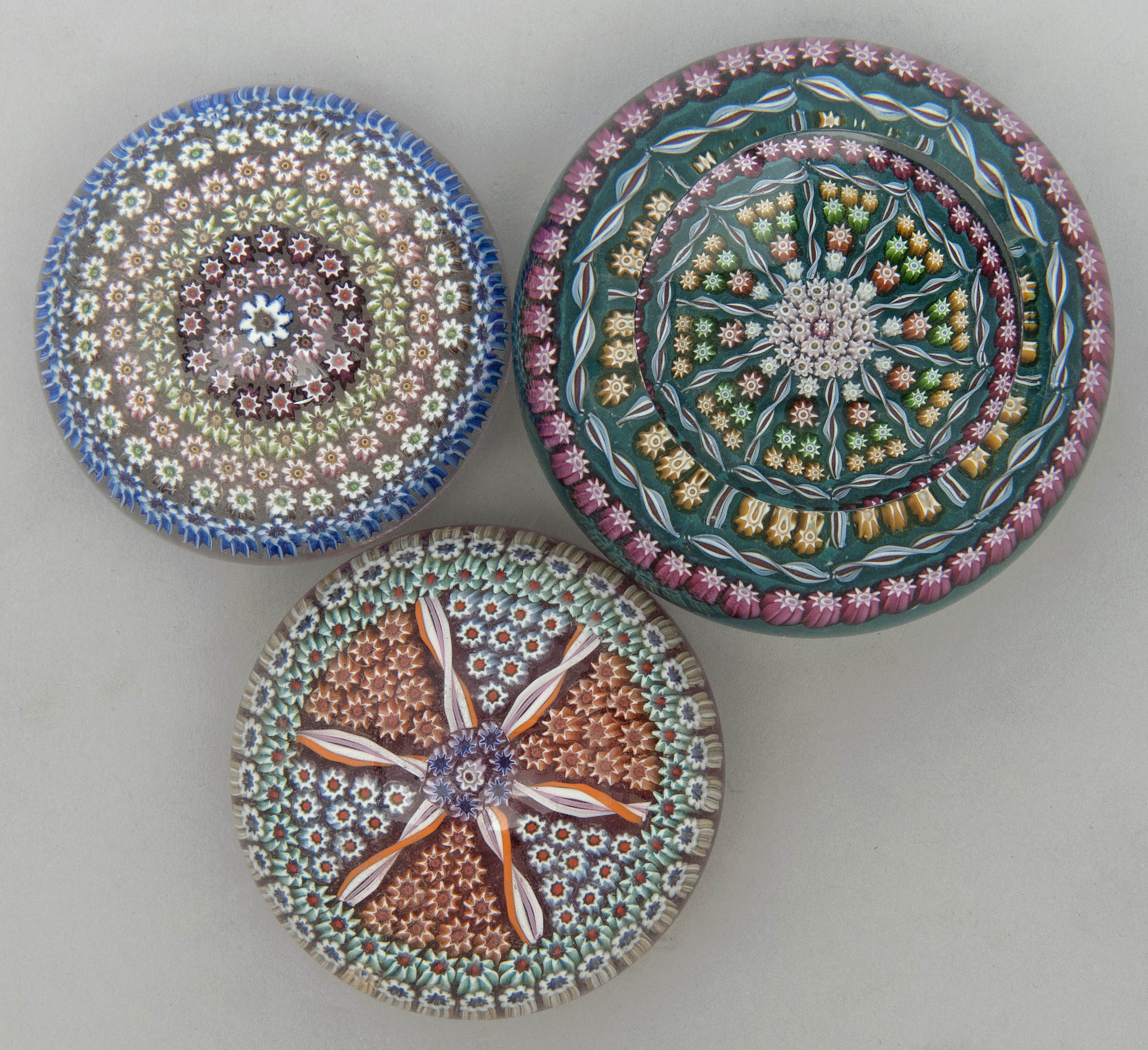 Appraisal: THREE PERTHSHIRE GLASS PAPERWEIGHTS ContemporaryMulti-cane designs in various colors and