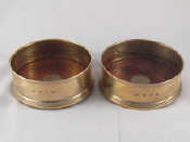 Appraisal: A pair of plain modern silver wine coasters by B