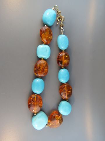 Appraisal: Turquoise and Amber Necklace large alternating beads long beautiful