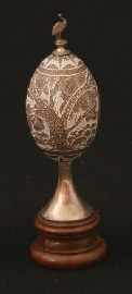 Appraisal: A Sterling Silver Mounted Emu Egg ovoid the body carved