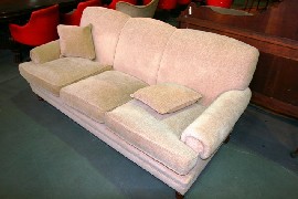 Appraisal: A lounge suite consisting of a beige upholstered three seater