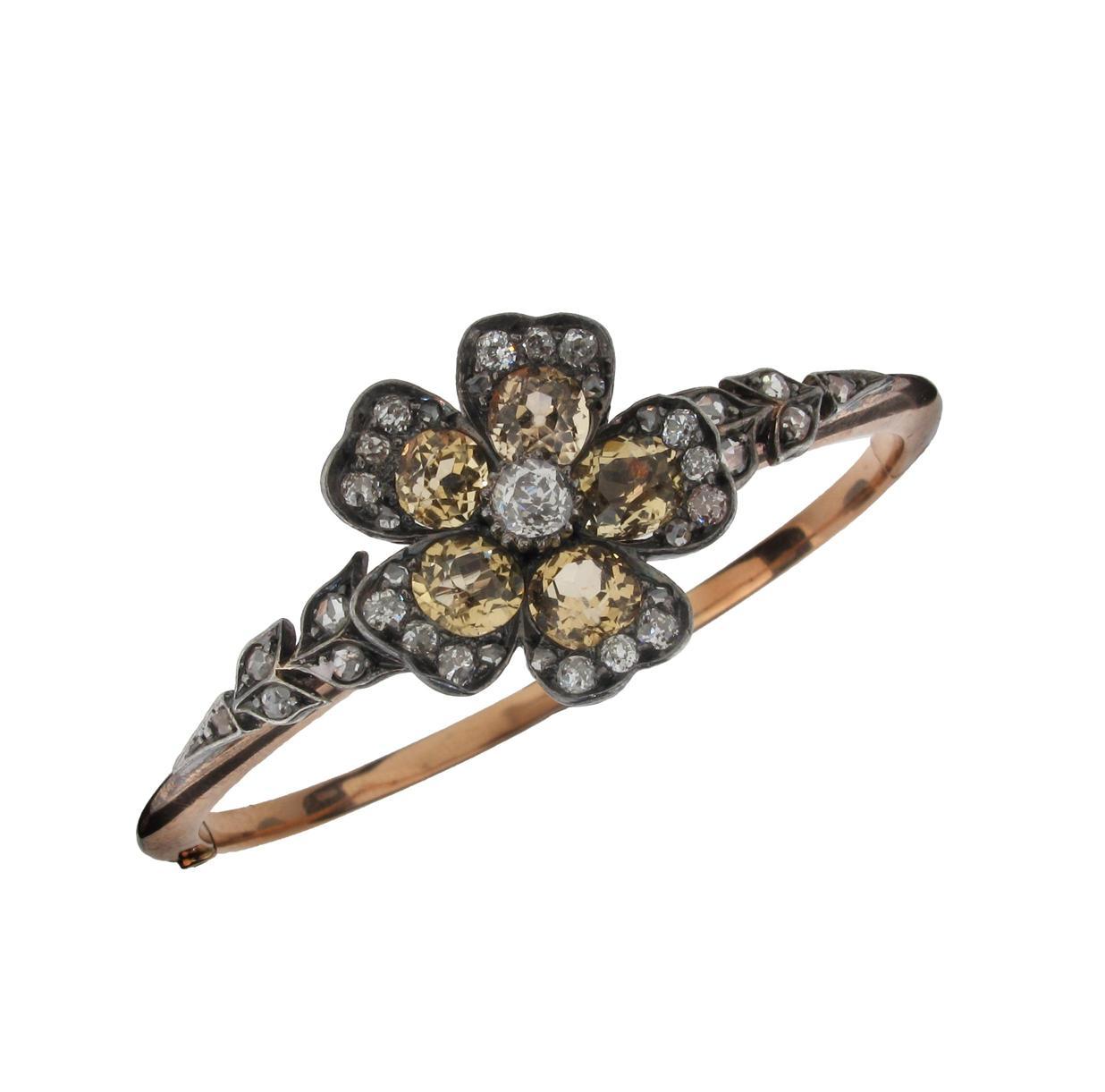 Appraisal: A Victorian flower head mounted hinged bangle