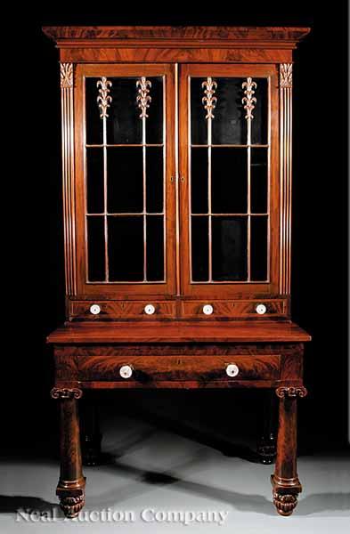 Appraisal: An American Classical Carved Mahogany Writing Table and Bookcase c