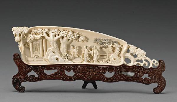 Appraisal: A tinted ivory tusk section th Century Shaped in the