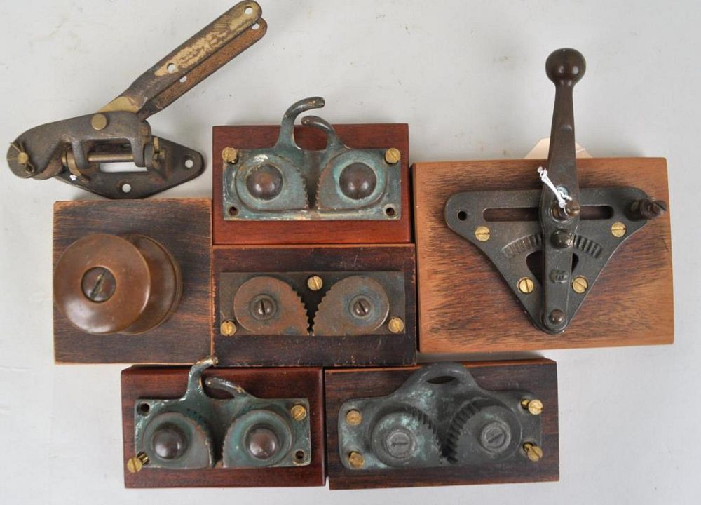 Appraisal: Group Seven Nautical Metal Ship's Line Locks mounted on wood