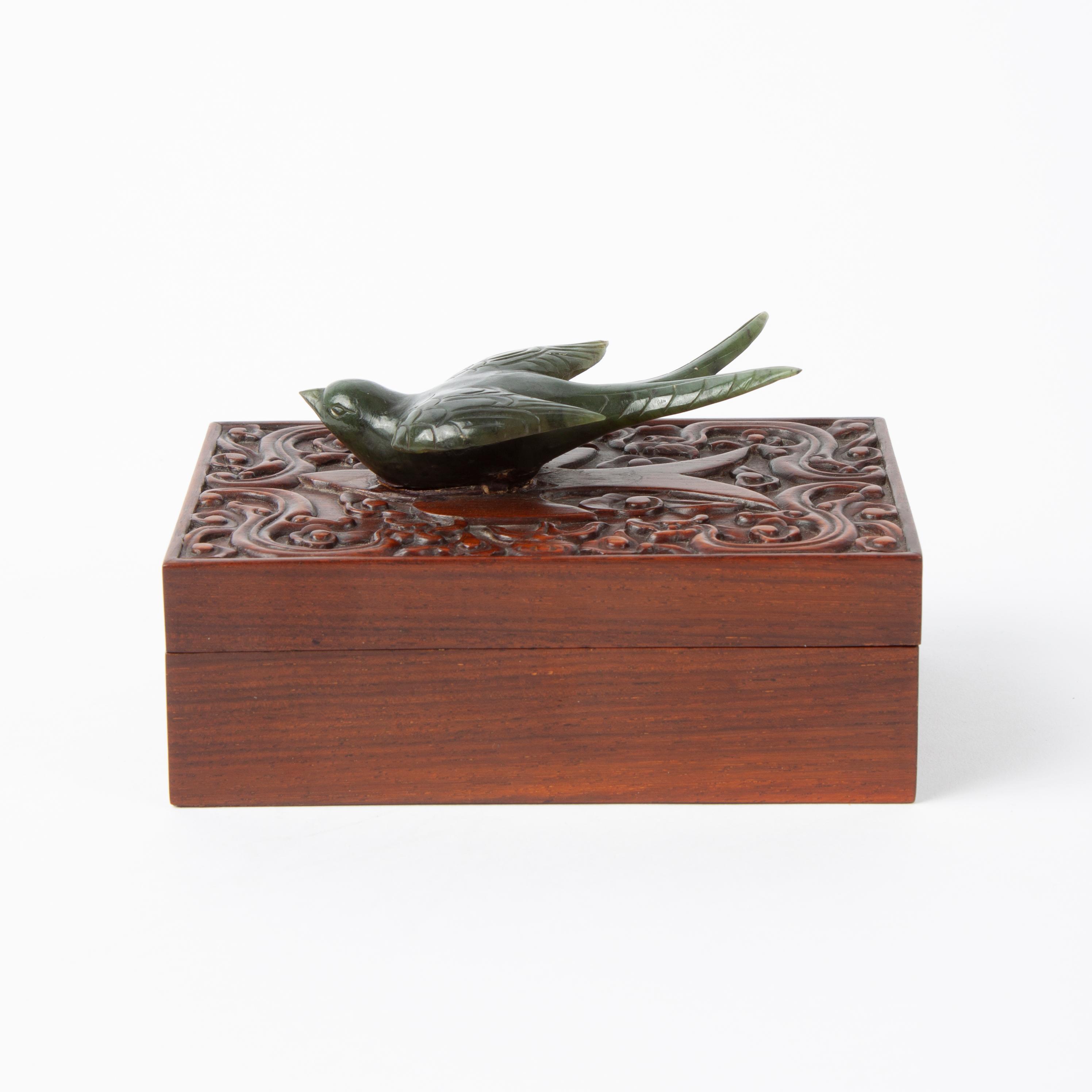 Appraisal: ROSEWOOD BOX WITH MOUNTED NEPHRITE JADE SWALLOW A rosewood box