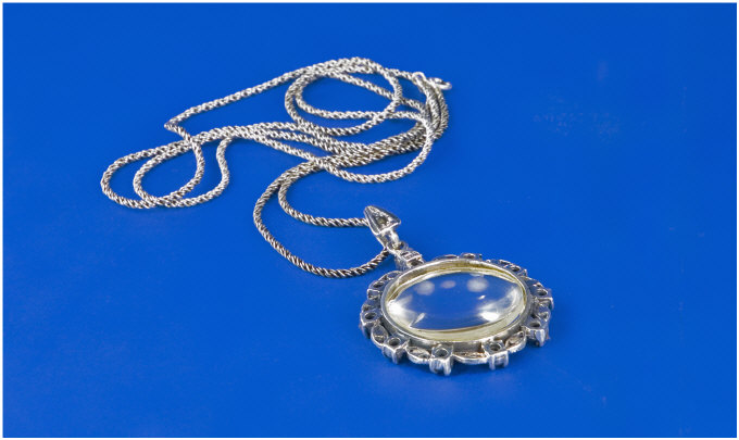 Appraisal: Silver Magnifying Glass Pendant And Rope Twist Chain Set With