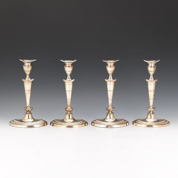 Appraisal: FOUR SILVER PLATED MIXED METALS CANDLEHOLDERS BY ELLIS-BARKER SILVER CO