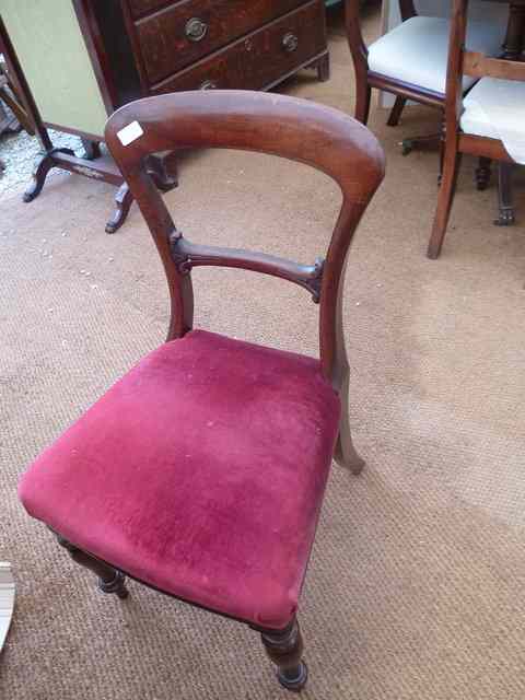 Appraisal: FOUR MAHOGANY BALLOON BACK DINING CHAIRS with purple overstuffed upholstered