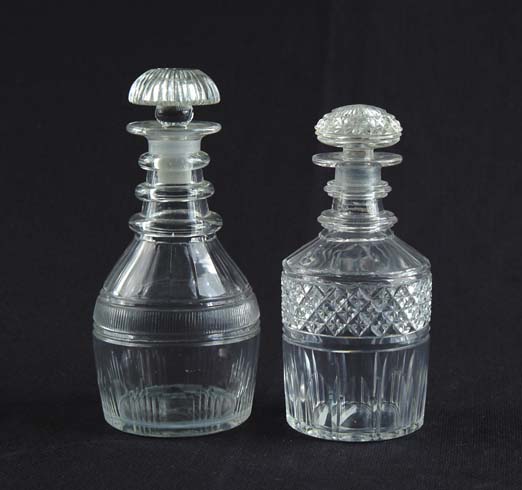 Appraisal: TWO STOPPERED DECANTERS Cut glass decanter has a band of