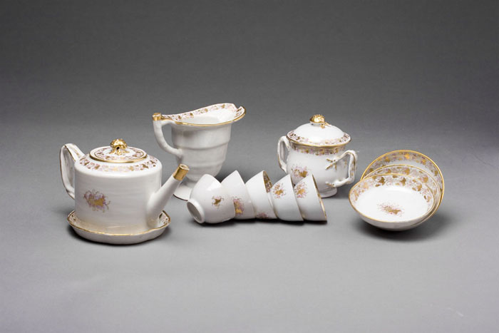 Appraisal: CHINESE EXPORT PORCELAIN CHILD'S TEA SET Including a strap handled