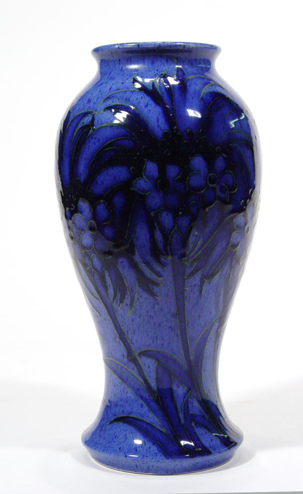 Appraisal: Moorcroft Pottery vase hand painted and tubelined with cornflower blue