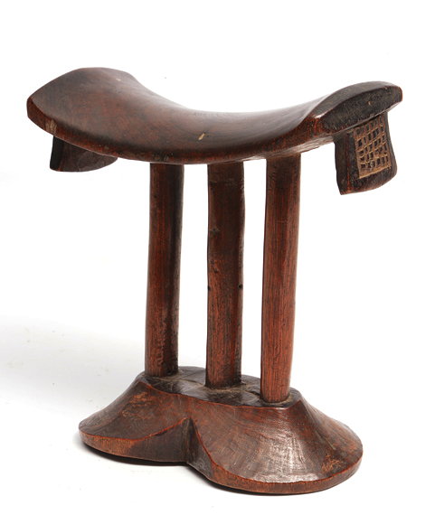 Appraisal: A WEST AFRICAN CARVED WOODEN TRIBAL HEADREST the curved top