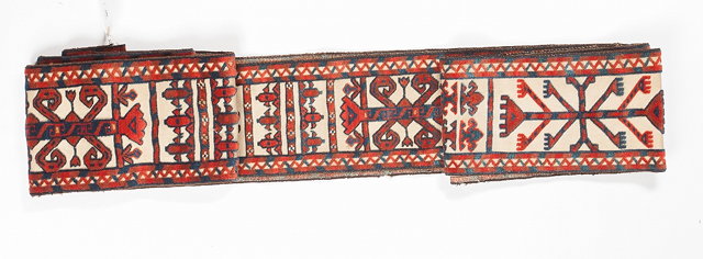 Appraisal: A TURKOMAN YOMUT TENT BAND with wine coloured hooked continuing