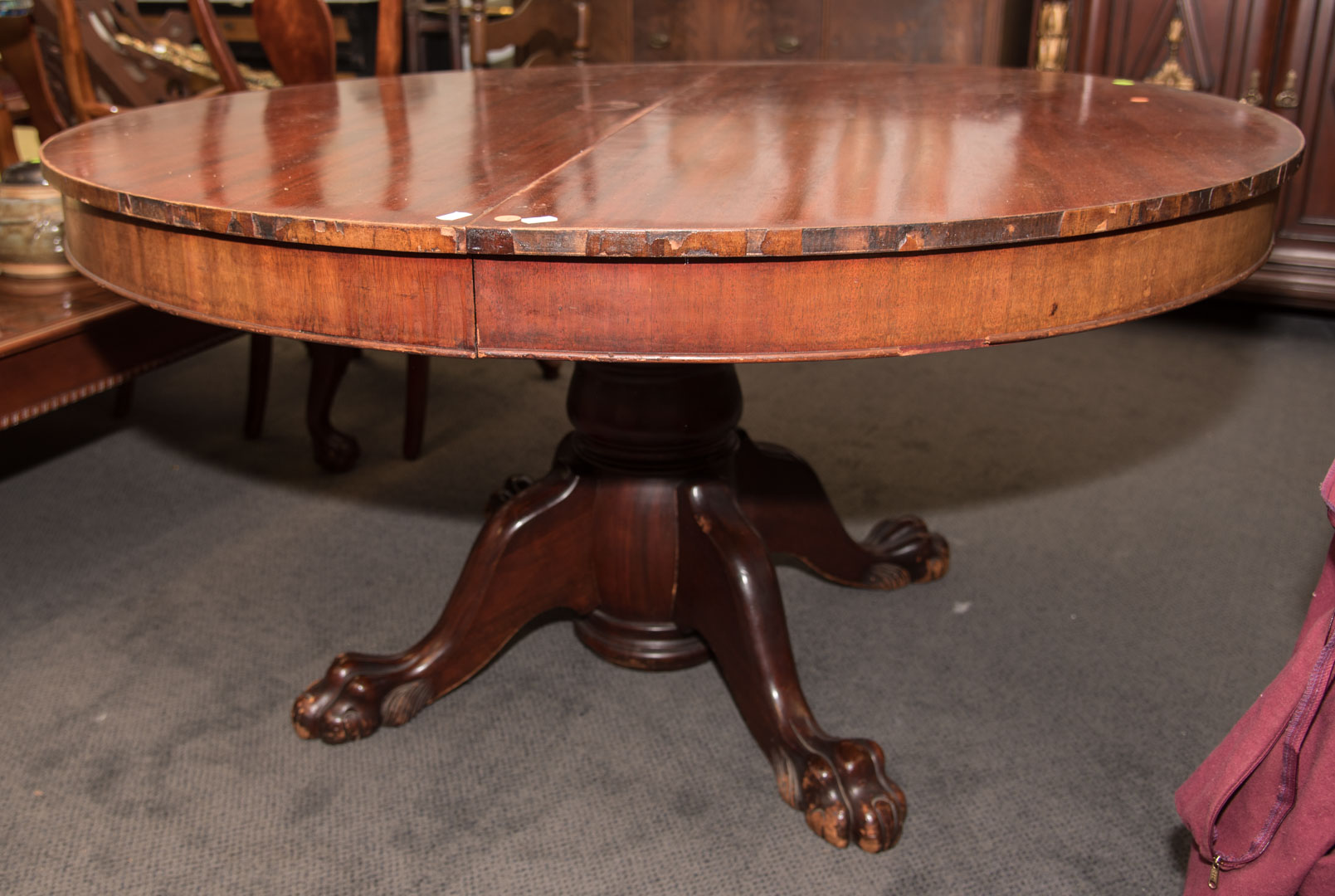 Appraisal: Round mahogany table with two leaves