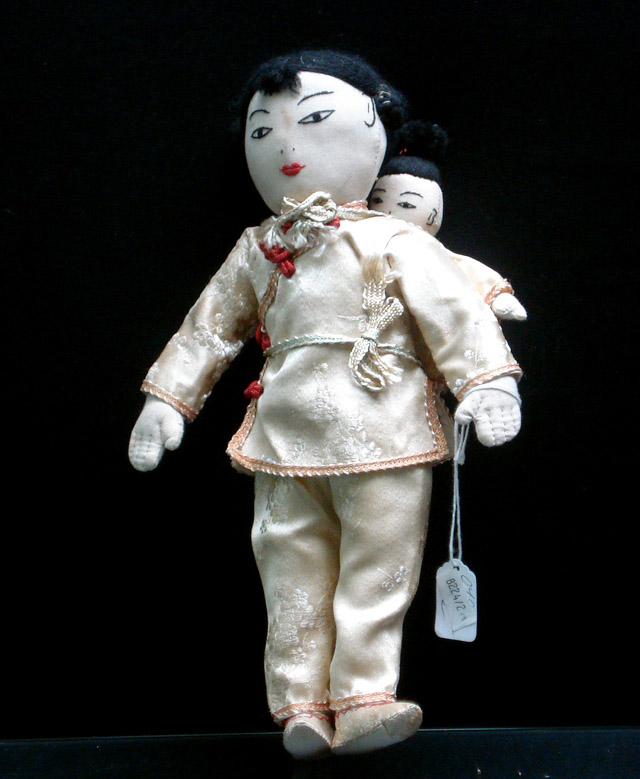 Appraisal: A Chinese fabric doll with child