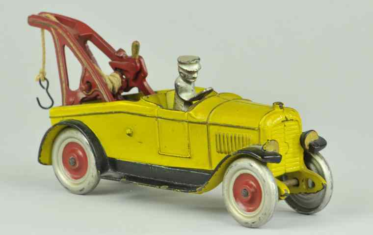 Appraisal: KENTON WRECKER Mid 's cast iron painted in yellow body