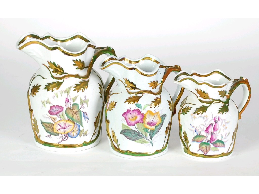 Appraisal: LATE NINETEENTH CENTURY GRADUATED TRIO OF STONEWARE JUGS with gilt