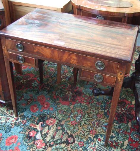 Appraisal: A George III mahogany lowboy the rectangular top over one