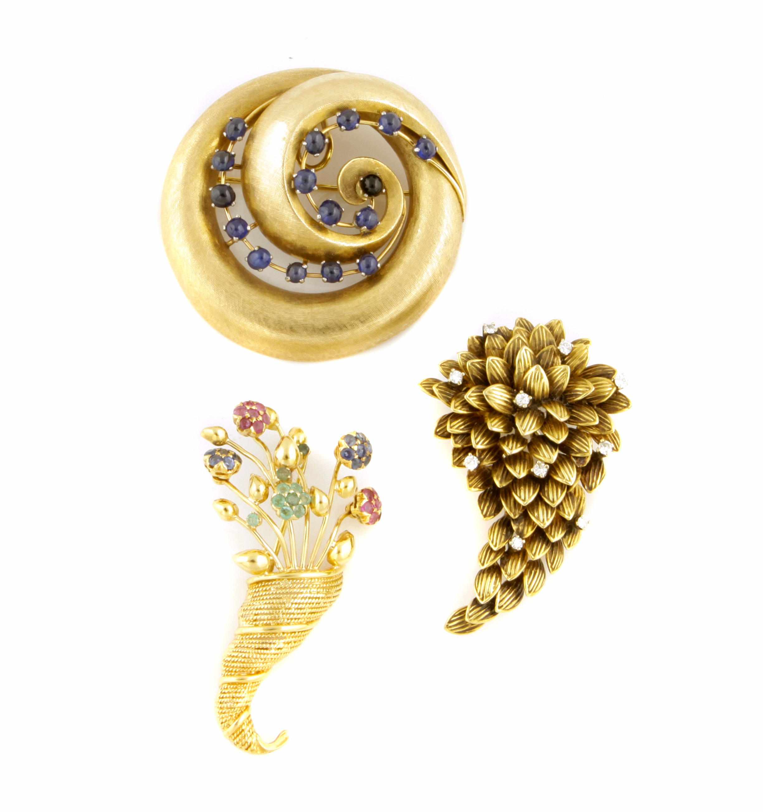 Appraisal: A collection of three gem-set diamond and gold brooches comprising