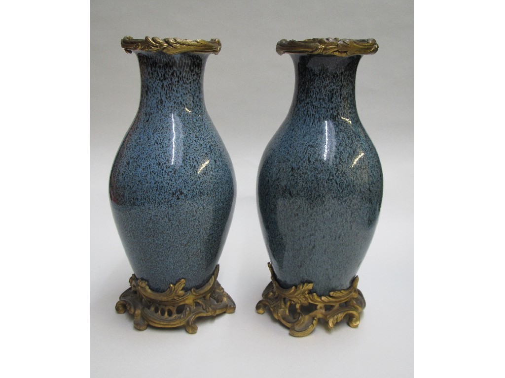 Appraisal: A pair of Chinese flambe speckled lavender baluster vases with