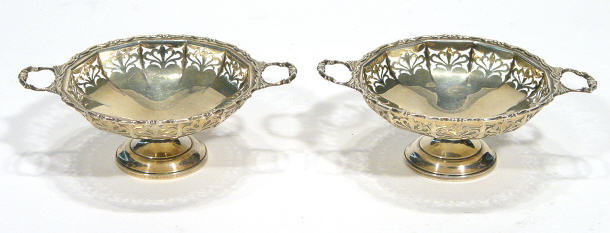 Appraisal: Two silver pierced bonbon dishes with twin handles Birmingham each