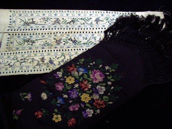 Appraisal: A Victorian black silk stole with machine embroidered panels of