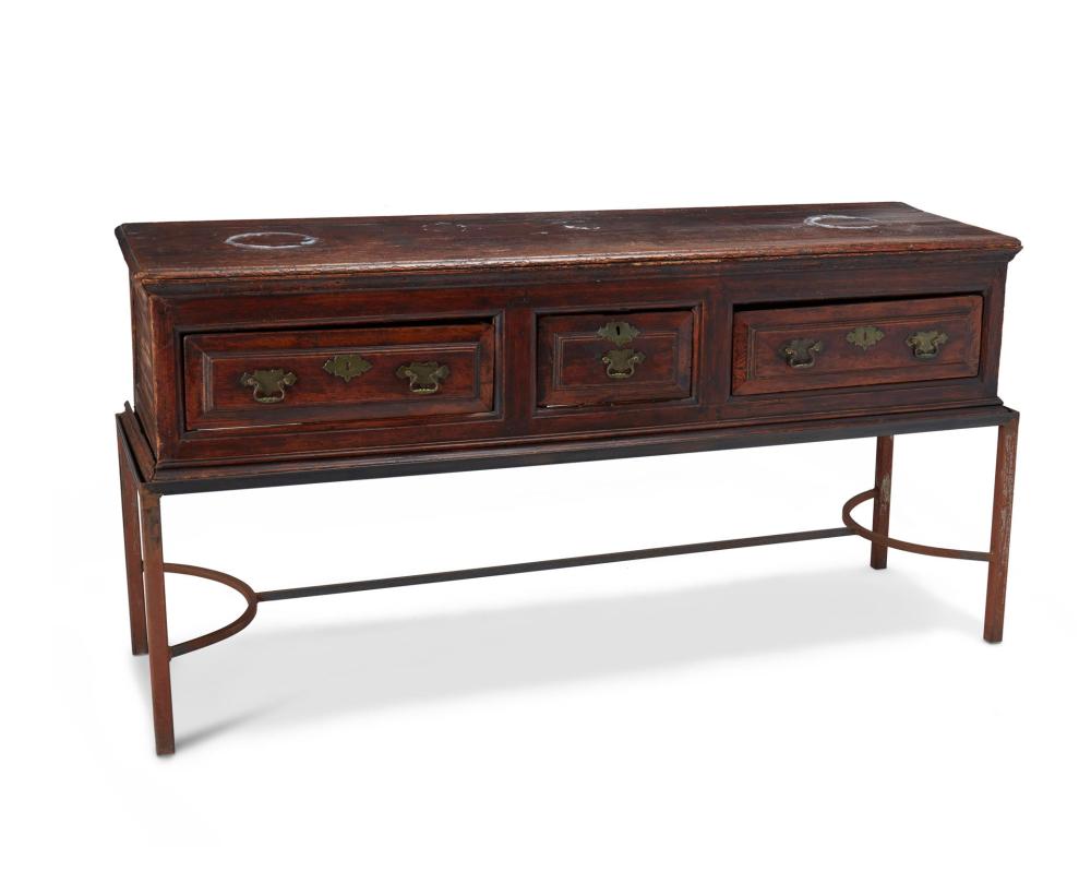 Appraisal: An English stand Late th Early th Century The three-drawer