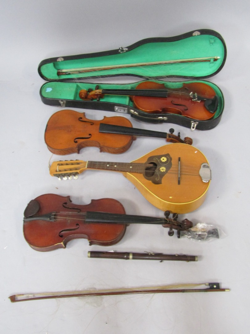 Appraisal: A violin and bow cased two further violins bow part