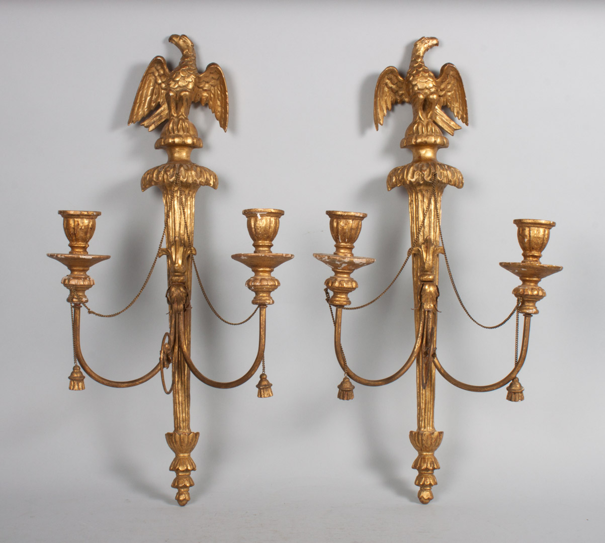 Appraisal: Pair of Empire style carved gesso giltwood sconces eagle finial