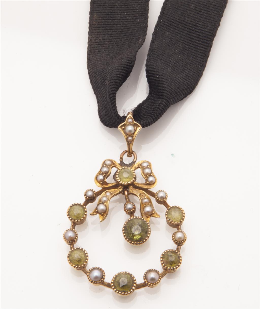 Appraisal: An Edwardian pearl and peridot set pendant of open circular