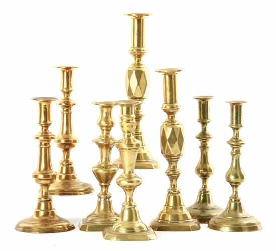 Appraisal: Collection of English brass candlesticks th century four pairs of