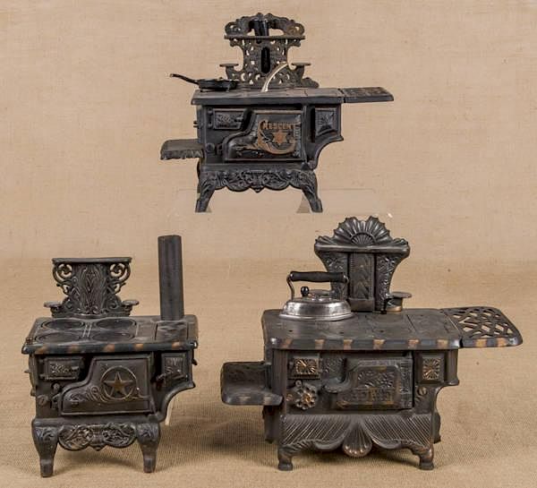 Appraisal: Three cast iron toy stoves to include a Grey Iro