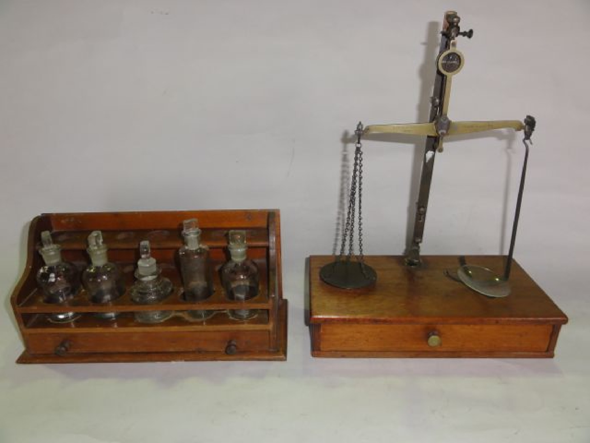 Appraisal: A vintage brass framed set of apothecary scales with a